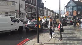 London man lights himself on fire, forces road closures