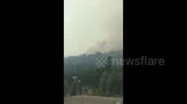 'Hurry up dad!' child says to his dad while driving past July Mountain Wildfire in Canada