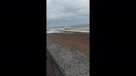Sandgate sea front on a very windy day. Big waves in Folkestone.