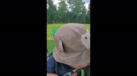 Adorable baby tries out the swing for the first time at the park