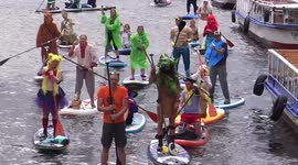Hundreds join dress-up paddleboard event in Russia