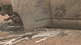 Rivers of molten aluminum extend from a burned out SUV in Indian Falls, California a victim of the Dixie Fire