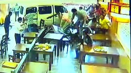 Minibus smashes into restaurant in China