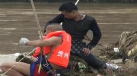 Man rescued from a swollen river in China