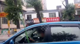 Woman drives while attached to an IV drip