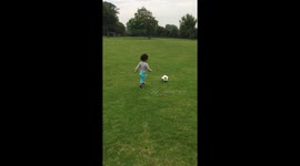 21 month old boy with amazing close football skills, who also loves flowers
