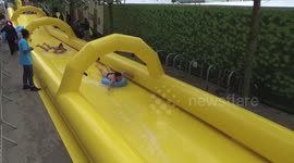 Huge 100m water slide outside London station