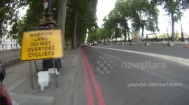 Van ignores signs and almost crashes into bike