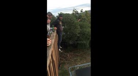 Fail Guy jumps off balcony onto trampoline