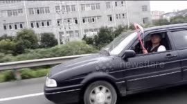 Man caught driving with IV drip in China