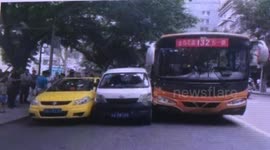 Bus crashed with two cars side by side