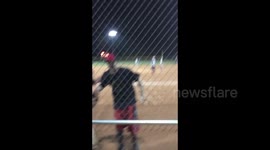 Runner leaps over catcher to score amazing softball play