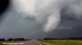 Cone tornado and rainbow in North Dakota, US