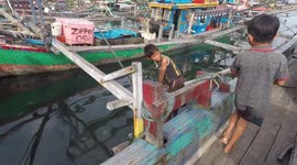 Funny Kids Around Big Boat Wait for Free Fish From Fishermen