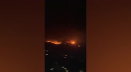 Scattered wildfires burn through hillside of toruist destination in Greece