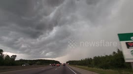 Driving under menacing clouds