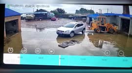 Forklift rolls into warehouse after being knocked by reversing car in northern China