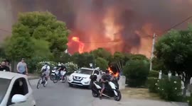 Wildfire burning through Athens suburb triggers evacuations
