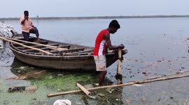 The boat man has trying to move safe places for heavy rain in Ganga river