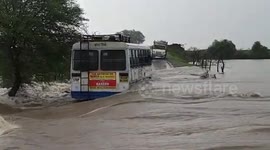 Passengers rescued after bus in northern India gets caught in raging floodwaters