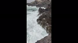 Strong waves smashing on rocks