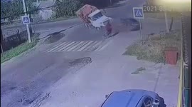 Cyclist wiped out after truck collides with car at crossroads in southern Russia