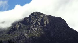Top of a mountain with clouds, wind in 4K resolution and nature sounds