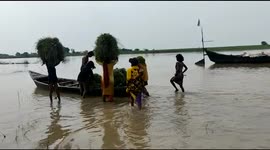 Bihar, India residents forced to escape heavy flooding by boat