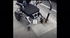 Wheelchair secured eith hike chain and lock in London