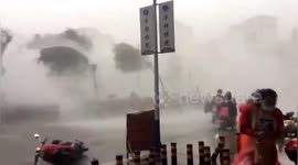 Powerful winds blow over security booth and inflatable castle in southern China