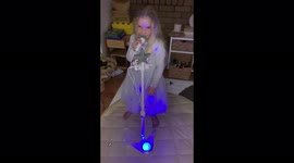 Little girl singing her heart out in her princess dress