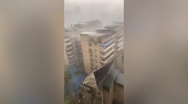 Huge fireball erupts after roof ripped off by powerful winds falls onto cables