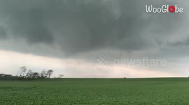 US storm chasers in awe as tornado passes just in front of their vehicle
