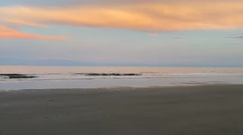 Beach waves at sunset