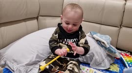 Cute 9 month old Baby Conducts and Dances with Elephant Toy