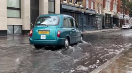 Flooded streets after heavy rain in London, United Kingdom, 7 August 2021