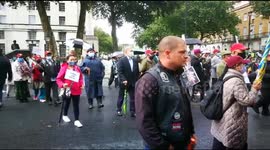 Gurkhas protest at Downing Street, while policeman hugs old comrade at demo