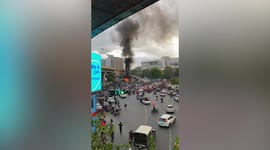 Thai anarchists set alight police truck during protest in Bangkok