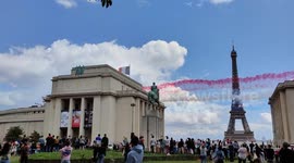 Jets stream smoke past Eiffel Tower as Olympics pass from Tokyo to Paris