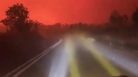 Wall of flame as car drives towards inferno on Greece's Evia island