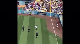 Ball girl takes down fan running on field at Dodger baseball stadium