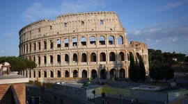 View of the Roman Colosseum and streets from above in Summer 2021, Italy