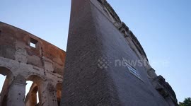 Details of wall and gates of the Roman Colosseum in Italy at sunset.