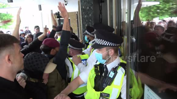 Scuffles as anti-vaccine protesters attempt to storm BBC's Television Centre in London