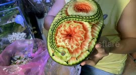 Vietnamese chef sculpts beautiful 3D flowers on a watermelon.