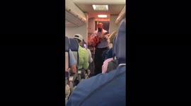 Kindly Southwest Airlines flight attendant plays 'Country Road' for delayed passengers