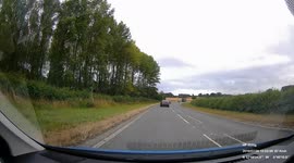 UK Dash Cam footage of a illegal overtake, almost head on crash
