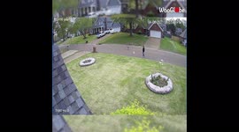 Security camera footage shows unleashed dogs launch attack on passing pup