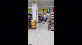 Rainwater gushes through supermarket roof after storm hits Glasgow