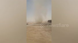 Fearless drivers power through dust devil in Riyadh, Saudi Arabia